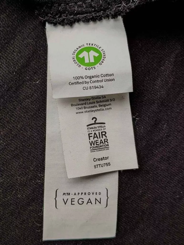 GOTS, FWF and PETA label attached to a fair organic vegan T-Shirt at GuterStoff.com textile merchandising Vienna Austria